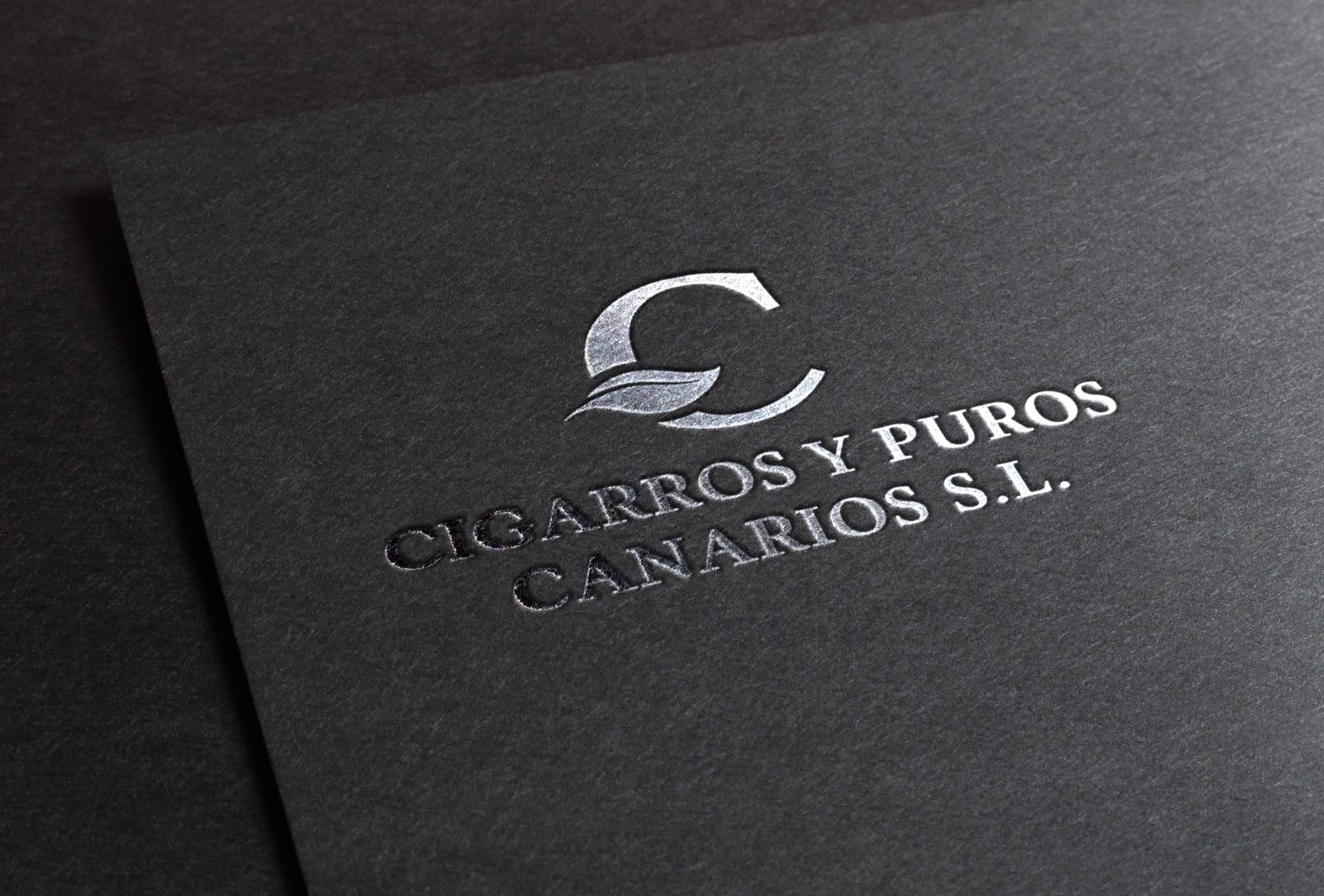 Logotipo de Cigarros y Puros Canarios estampado en plata
